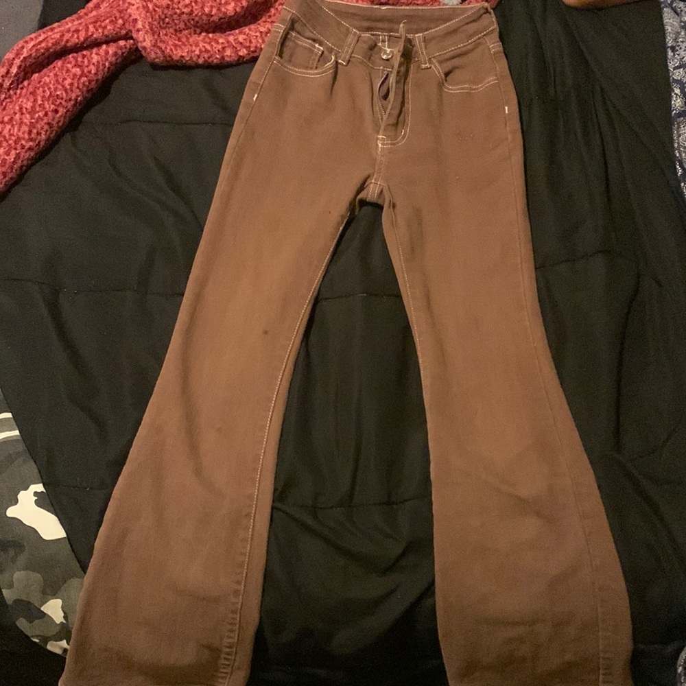 Brown butterfly flare jeans.